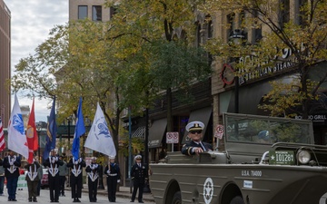 A member of the U.S. Navy Cruiser Division participates in the Milwaukee Veterans Day Parade