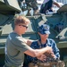 Military personel interact with the public on Broadway Pier Pavilion During Fleet Week San Diego 2024.