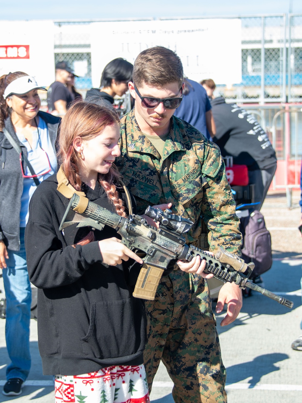 Military personel interact with the public on Broadway Pier Pavilion During Fleet Week San Diego 2024.