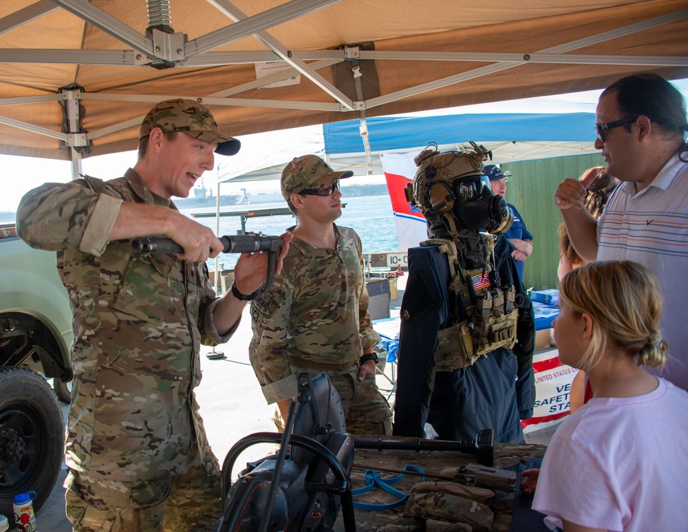 Military personel interact with the public on Broadway Pier Pavilion During Fleet Week San Diego 2024.