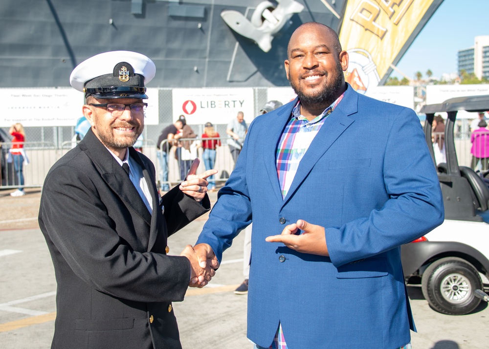 Military personel interact with the public on Broadway Pier Pavilion During Fleet Week San Diego 2024.