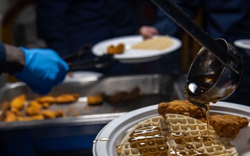 USS Ronald Reagan (CVN76) Sailors serve brunch