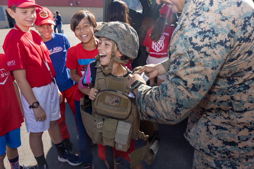 Marines spend time with students at the Annual Sunset Hills Elementary School Veterans Day Program