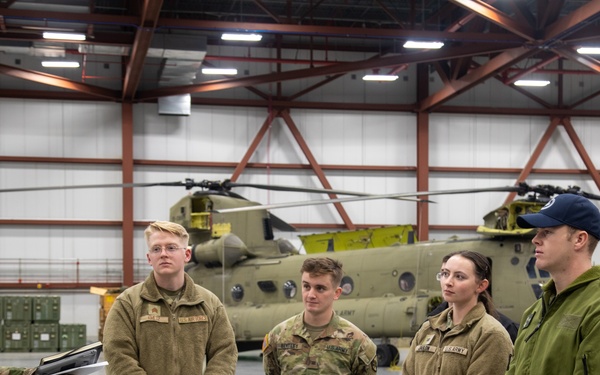 1st. Lt. Atwood Leads Military Members on a Tour of an Aircraft Hangar