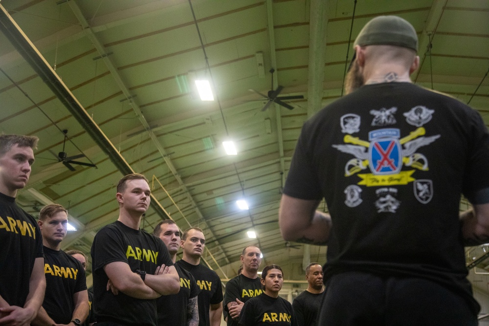 Soldiers Listen to the Holistic Health &amp; Fitness Instructor During Physical Training