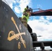 Soldiers Prepare to Transport a AH-64D Apache Helicopter