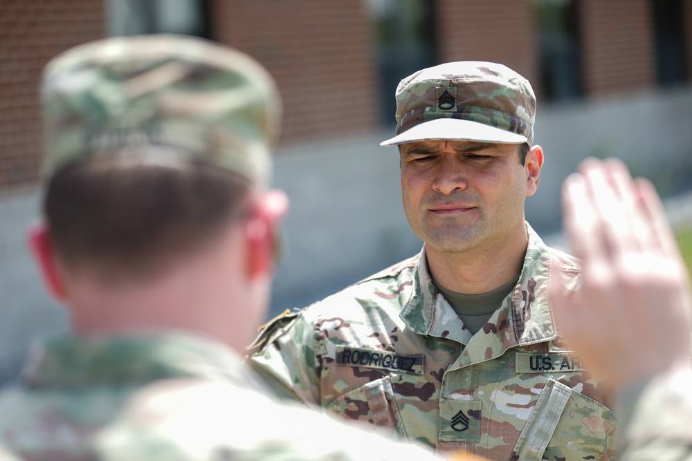 Staff Sgt. Rodriguez Raises His Right Hand During the Oath of Enlistment