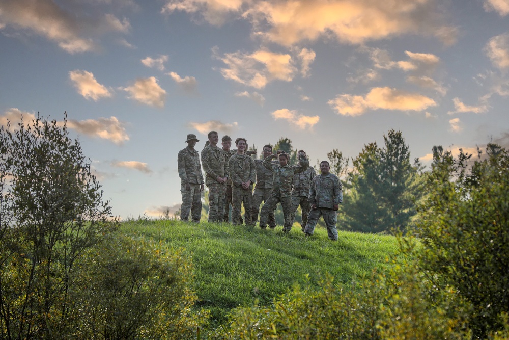 Soldiers Stand atop a Hill at the 5 Pads Forward Arming Refueling Point