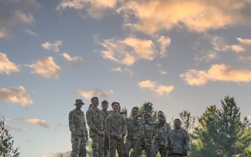 Soldiers Stand atop a Hill at the 5 Pads Forward Arming Refueling Point