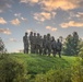 Soldiers Stand atop a Hill at the 5 Pads Forward Arming Refueling Point