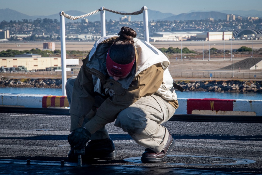 Nimitz Sailor Performs Maintenance on Flight Deck