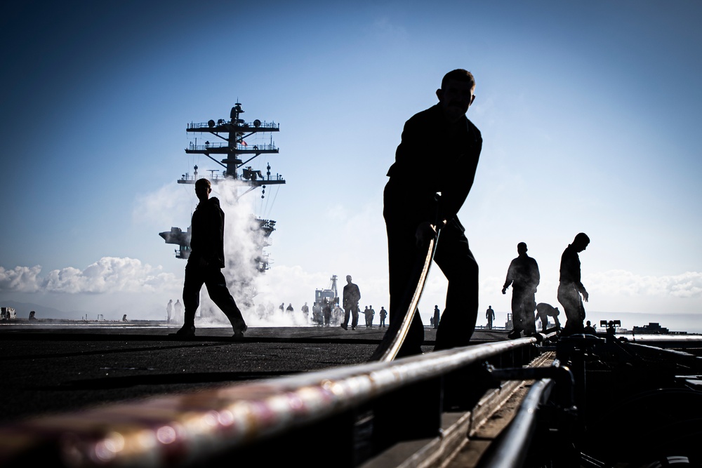 Nimitz Sailors Move Catapult Covers