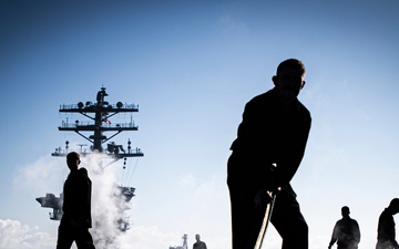 Nimitz Sailors Move Catapult Covers