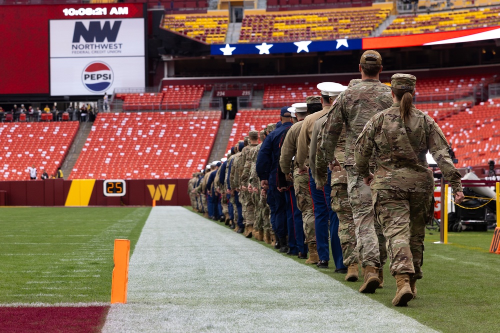 U.S. service members participate in Salute to Service NFL game