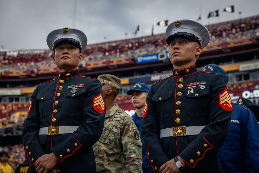 U.S. service members participate in Salute to Service NFL game