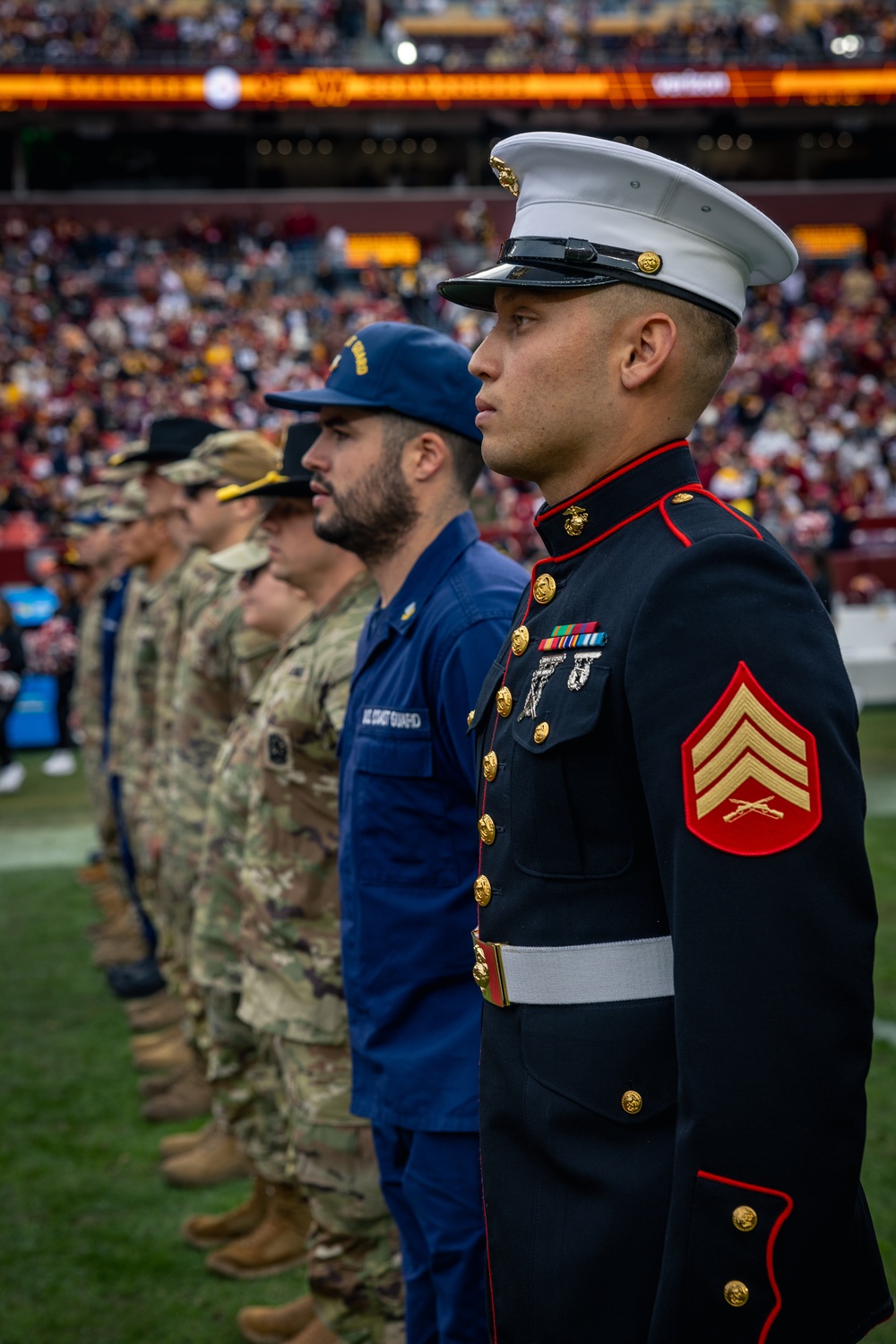 U.S. service members participate in Salute to Service NFL game