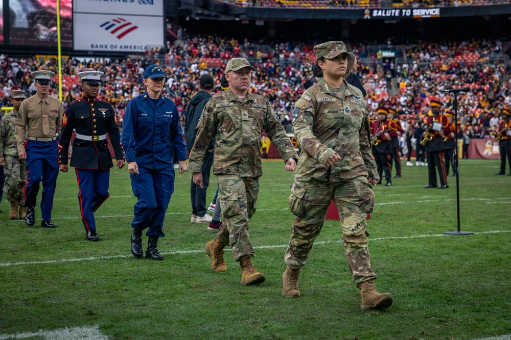 U.S. service members participate in Salute to Service NFL game