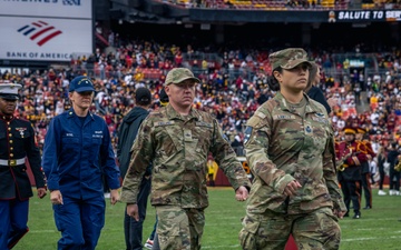 U.S. service members participate in Salute to Service NFL game