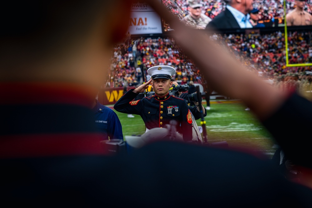 U.S. service members participate in Salute to Service NFL game