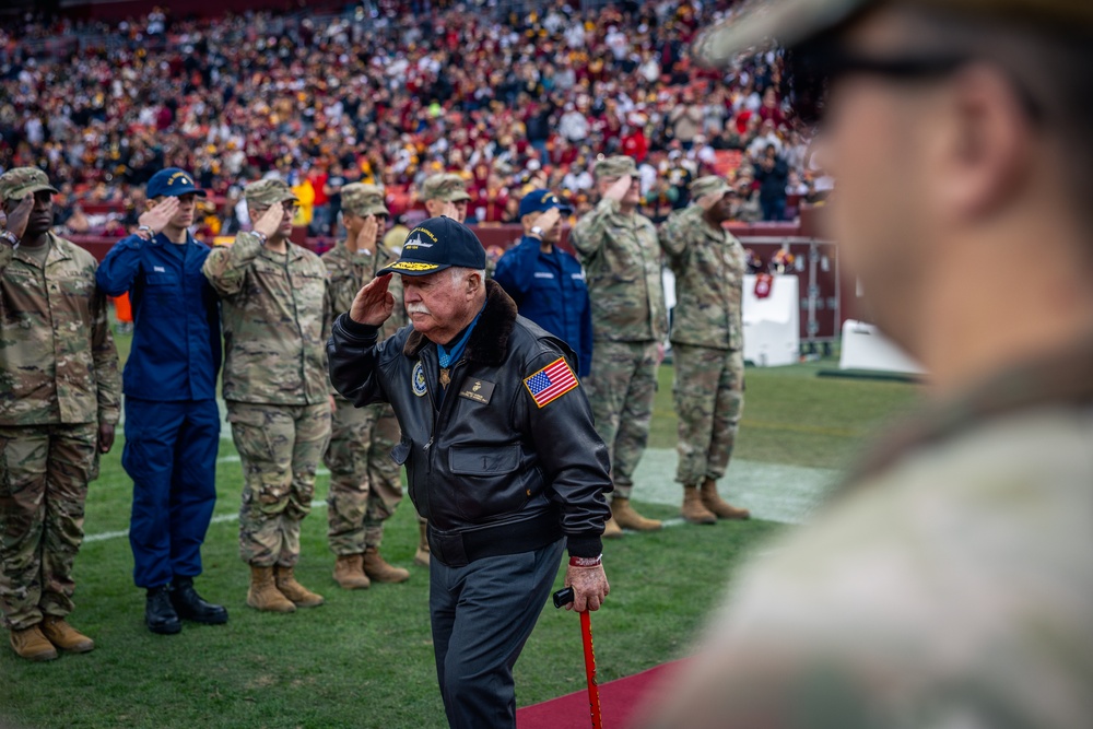 U.S. service members participate in Salute to Service NFL game