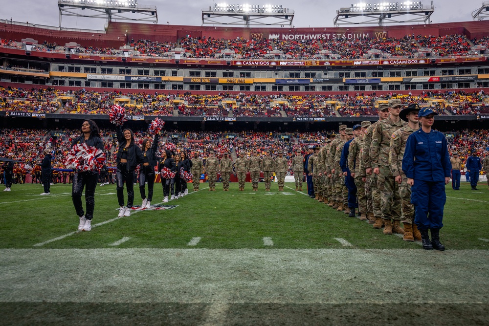 U.S. service members participate in Salute to Service NFL game