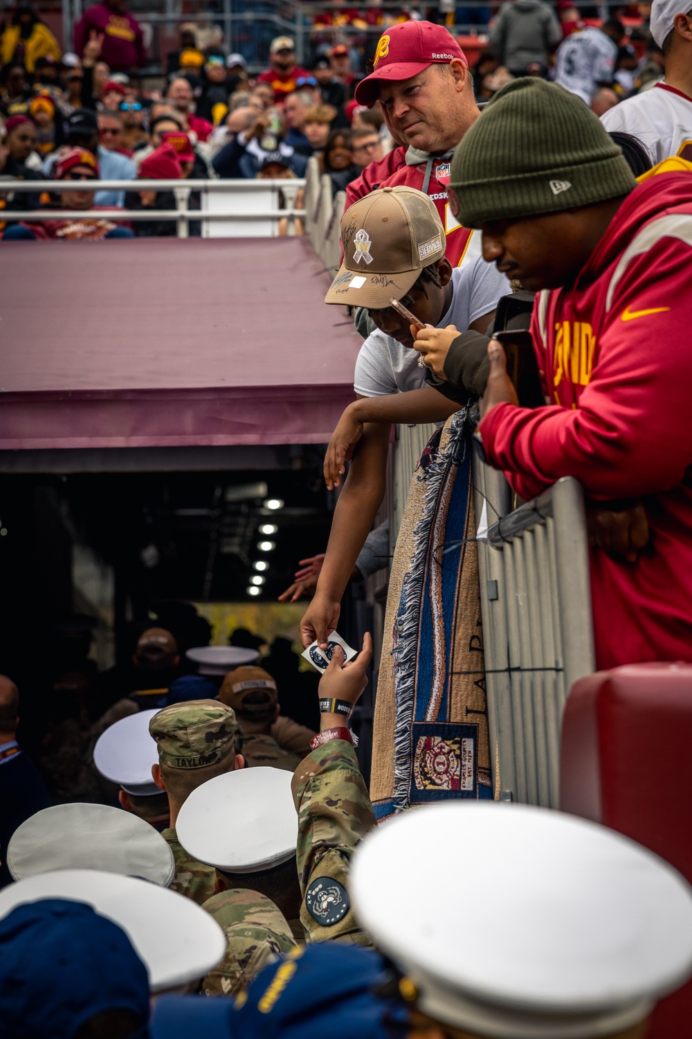 U.S. service members participate in Salute to Service NFL game