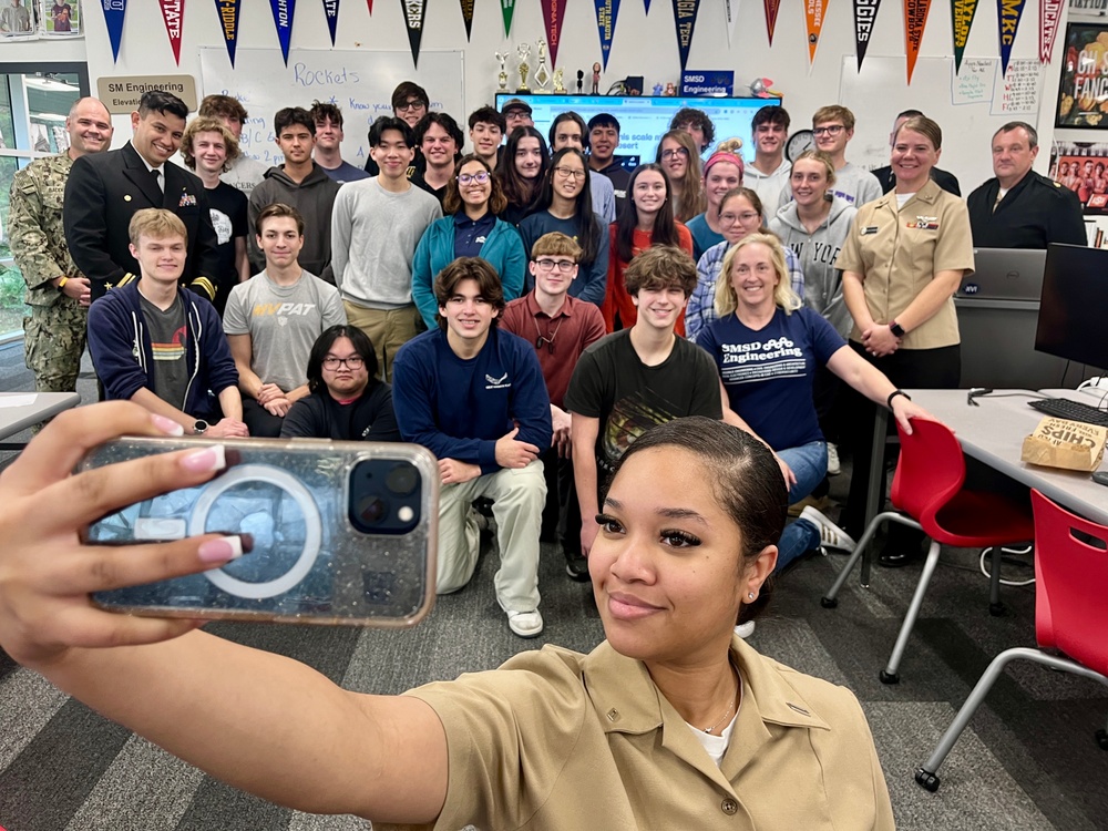 Navy Reserve Center Kansas City Sailors pose with students after a talk