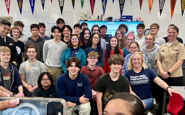 Navy Reserve Center Kansas City Sailors pose with students after a talk