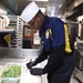 USS John C. Stennis (CVN 74) Sailors prepare meal