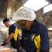 USS John C. Stennis (CVN 74) Sailors prepare meal