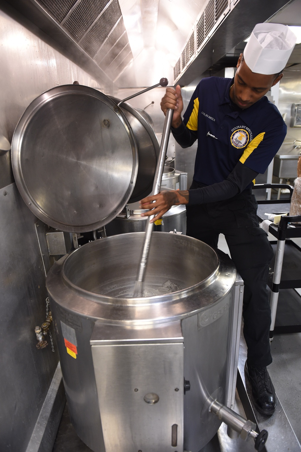 USS John C. Stennis (CVN 74) Sailors prepare meal