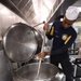 USS John C. Stennis (CVN 74) Sailors prepare meal