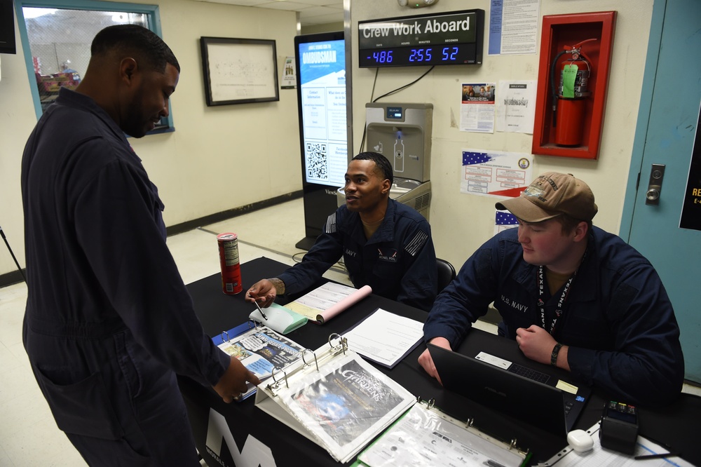 USS John C. Stennis (CVN 74) Sailors sell MWR Tickets