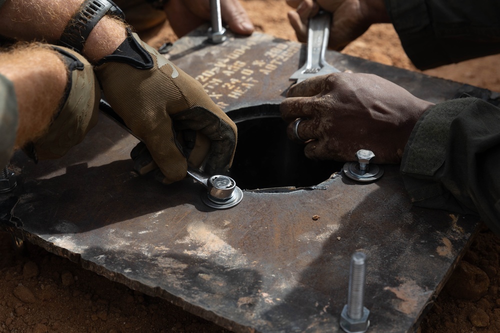 MWSS-172 explosive ordnance disposal technicians test HIMARS missile functionality