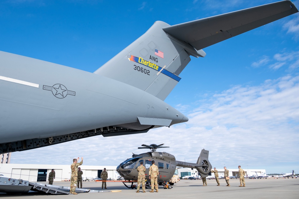 Airmen and Soldiers of the NCNG load UH-72B Lakota onto C-17 Globemaster III