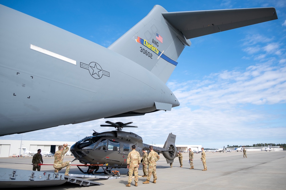 Airmen and Soldiers of the NCNG load UH-72B Lakota onto C-17 Globemaster III