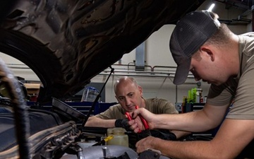 726th EMSS commander pops the hood with vehicle maintenance Airmen