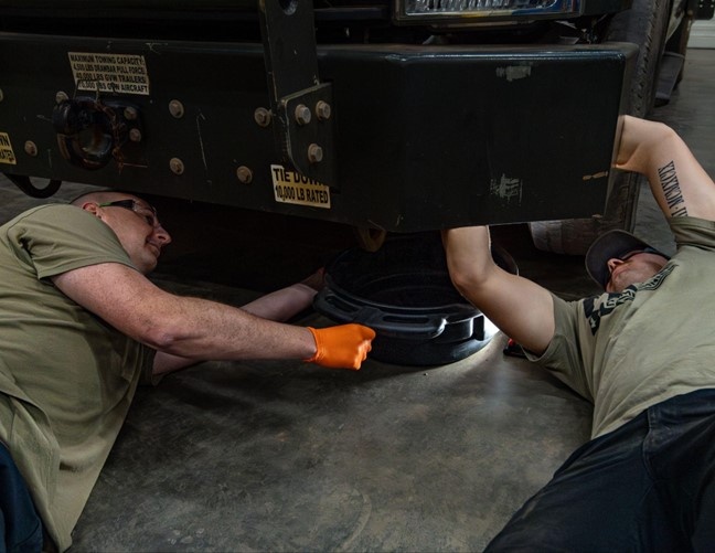 726th EMSS commander pops the hood with vehicle maintenance Airmen