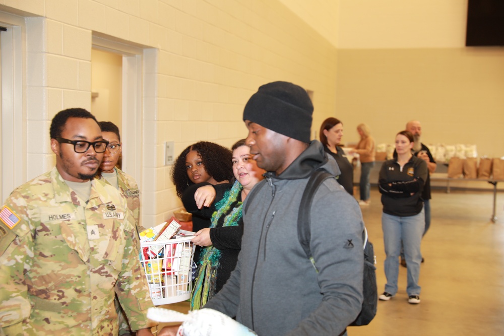 Service Member Receives a Turkey and Food Basket (2 of 3)