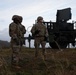 U.S. Soldiers stand in front of a Sentinel radar