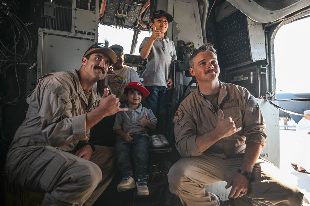 U.S. military personnel interact with spectators at the Bahrain International Airshow 2024