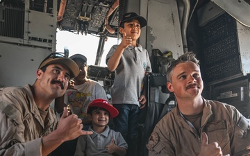 U.S. military personnel interact with spectators at the Bahrain International Airshow 2024