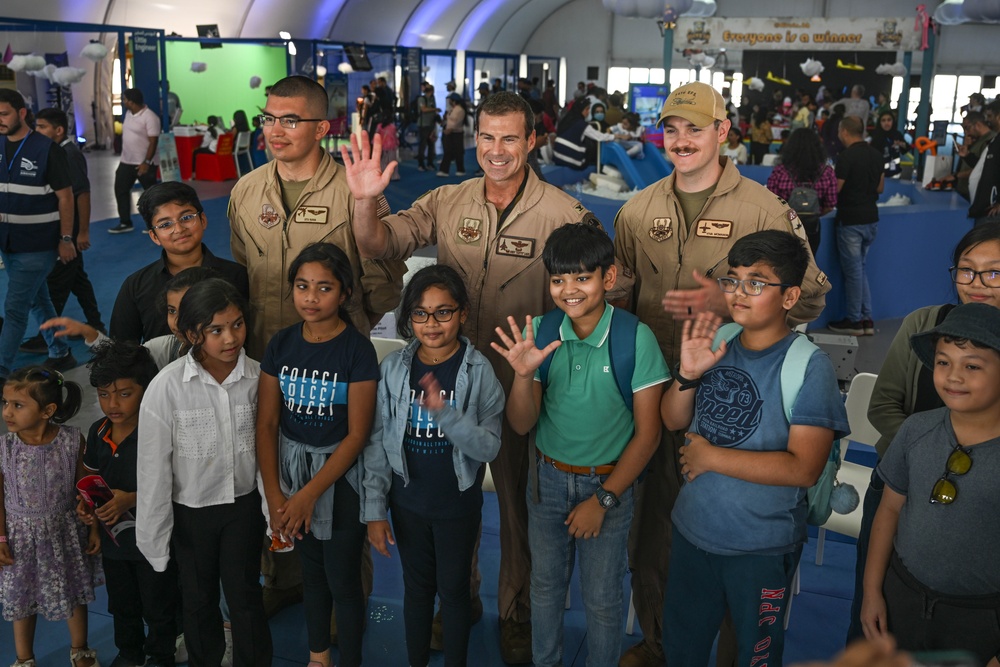 U.S. military personnel interact with spectators at the Bahrain International Airshow 2024