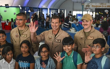 U.S. military personnel interact with spectators at the Bahrain International Airshow 2024