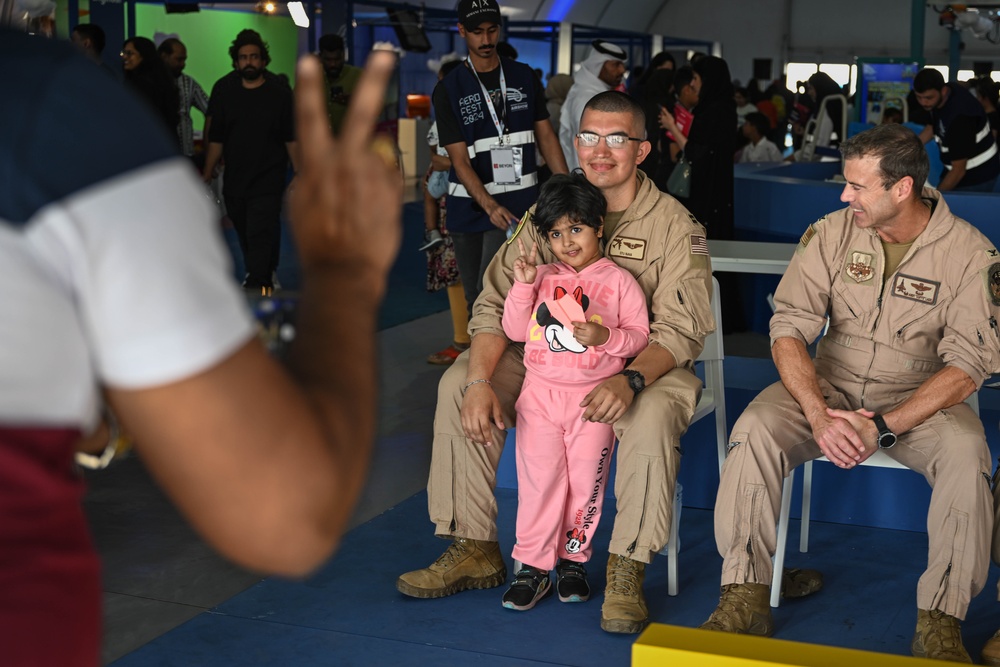 U.S. military personnel interact with spectators at the Bahrain International Airshow 2024