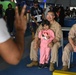 U.S. military personnel interact with spectators at the Bahrain International Airshow 2024