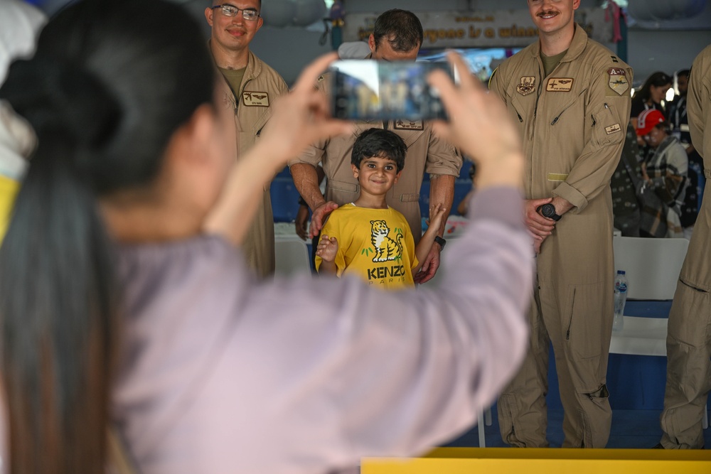 U.S. military personnel interact with spectators at the Bahrain International Airshow 2024