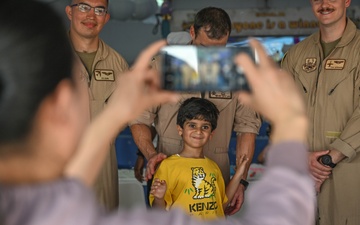 U.S. military personnel interact with spectators at the Bahrain International Airshow 2024