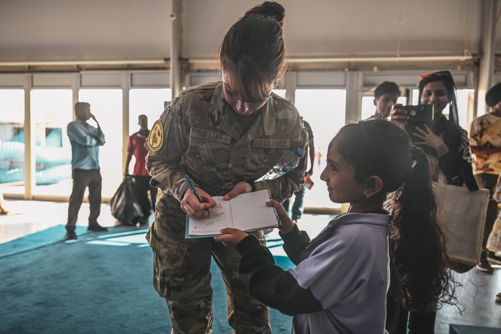 U.S. military personnel interact with spectators at the Bahrain International Airshow 2024