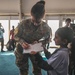 U.S. military personnel interact with spectators at the Bahrain International Airshow 2024